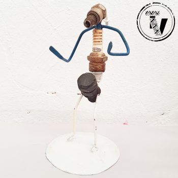 Recycled Spark Plug Drummer